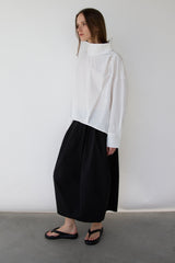 OVERSIZED PLEATED MOCKNECK BLOUSE