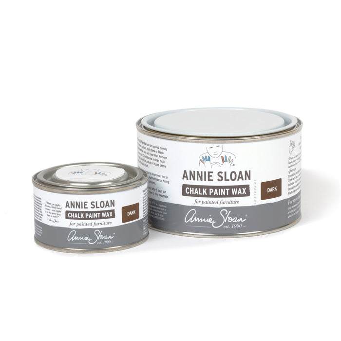 Two tins of Annie Sloan Chalk Paint Wax on a white background