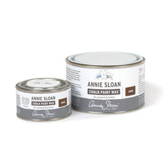 Two tins of Annie Sloan Chalk Paint Wax on a white background
