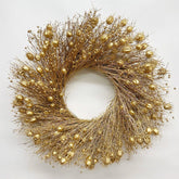 decorative Christmas wreath dried botanicals gold on a white background