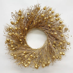 decorative Christmas wreath dried botanicals gold on a white background