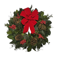 Christmas wreath with red bow, pine cones, and berries on a white background
