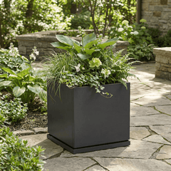 h potter Laurel planter 20 inch gray square with plants on a stone patio