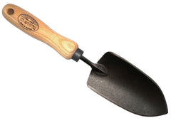 Close-up of H Potter × DeWit forged boron steel garden trowel showing hardwood handle and professional planting blade