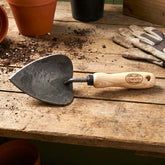 h potter dewit forge potting trowel on garden bench