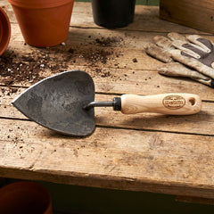 h potter dewit forge potting trowel on garden bench
