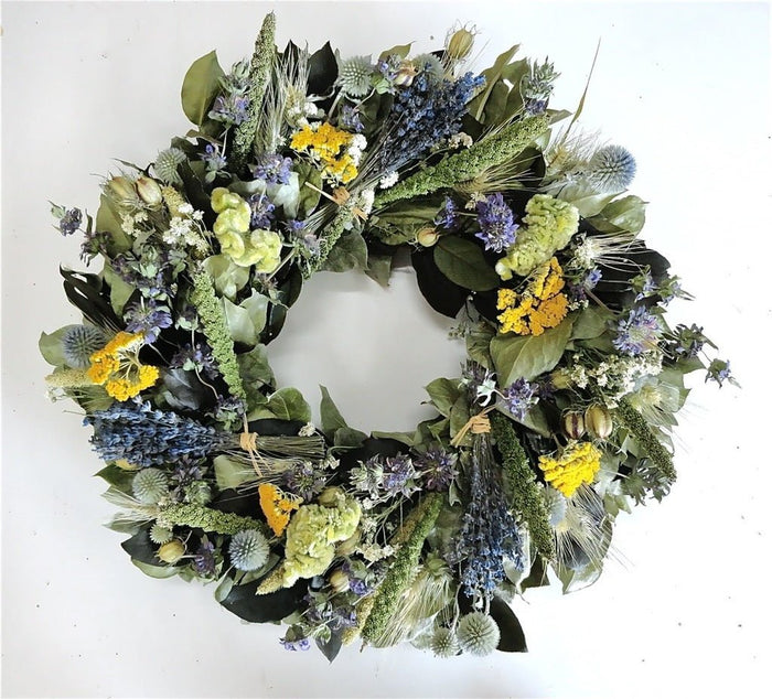 Floral preserved spring wreath with lavender, greenery, and yarrow. Yellow, green and blue wreath