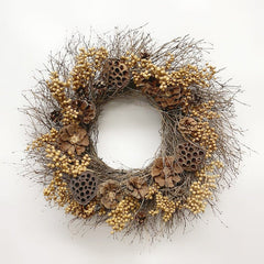 A rustic dried botanical wreath featuring natural twig branches, small beige berries, brown pinecones, and dried lotus pods, displayed against a clean white background.