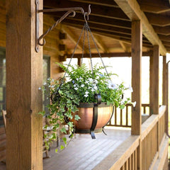 H Potter copper hanging planter with greenery on a wooden porch