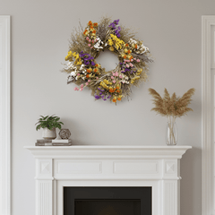 colorful spring botanical wreath on a white mantel with florals